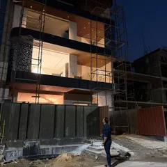 Another perspective of the Noida Sector 100 project, showcasing the curved corner of the facade, a key element of its modern design.