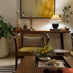 Another corner of my home. The warm glow of a lamp, a comfortable cane chair, and a touch of green from a bonsai tree create a perfect spot to unwind.