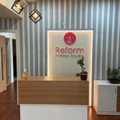 Your journey begins at our welcoming reception desk. The clean design, modern lighting, and touch of green from the bonsai tree set a calm and professional tone from the moment you walk in.