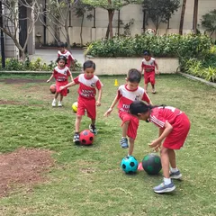 We bring the fun of football right to your community. Here, a group of kids in an apartment complex class learns basic footwork and coordination, surrounded by friends in a safe, familiar environment.