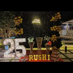 An elegant outdoor 25th birthday celebration by the pool. We used a black sequin wall, gold and black balloons, and marquee lights to create a sophisticated and memorable party atmosphere at night.