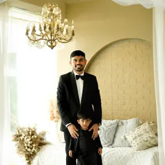 A handsome duo. We love capturing the special bond between fathers and sons, especially during a maternity session that celebrates the entire family's journey.