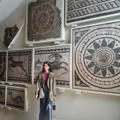 Standing in front of ancient mosaics, my modern outfit creates a fun contrast. This is what I love about style, it's a conversation with your surroundings.