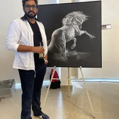 A proud moment at my art show in Hyderabad, standing with the Honorable Jayesh Ranjan ji, IAS. It was a privilege to discuss my charcoal art with him.