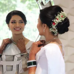 The moment a bride looks in the mirror and smiles, seeing her complete look for the first time. Her happiness and confidence are what make everything worthwhile.