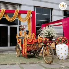 Fun and quirky decor elements like this decorated auto-rickshaw add a unique touch to Mehendi events and serve as a popular photo booth for guests.