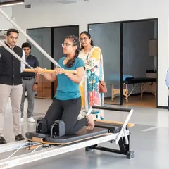 We were honored to host Ironman triathlete Shreyas Hosur and two-time Olympian Pramila Aiyappa, seen here observing a Pilates session at our physiotherapy and rehab center.