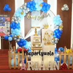 A blue and silver balloon ring with a 'Happy Birthday' banner, perfect for a boy's birthday party.