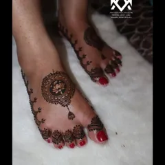 A simple and elegant foot design featuring a lotus mandala, perfect for a guest or a minimalist bride.