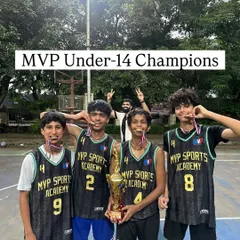 Another shot of our victorious Under-14 champions, medals around their necks and holding the trophy high. The smiles say it all.