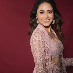 For Nushrratt Bharuccha, we created this dreamy pastel indo-western look, perfect for a sangeet or a daytime wedding. The delicate lacework and modern silhouette show how to blend traditional crafts with contemporary style.