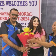 Receiving a bouquet at the SCBA Badminton Tournament 2024. It is important to balance the rigors of legal practice with sports and other activities to stay strong, both mentally and physically.