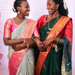 The beautiful bond between sisters, sharing a laugh and a hug on the wedding day.