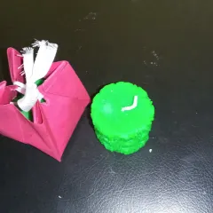 Another view of my decorative candle with its gift packaging. I focus on the candle itself, but simple packaging is available for gifting.