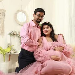 Happiness is on the way. This couple chose a lovely boho-chic setup in my studio, complete with a beautiful pink gown, to celebrate their journey to parenthood.