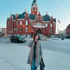 This photo was taken in Stratford, Ontario, featuring the historic town hall. It demonstrates how I can create content that blends fashion with local tourism, highlighting both my outfit and the charm of the location.