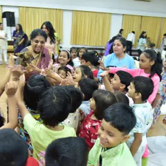 The purest joy is seeing a story reflected in a child's eyes. Here, surrounded by curious young minds at the Fravashi Academy, I am sharing a tale with a puppet friend. This is where the magic is most real, in these moments of shared wonder and laughter.