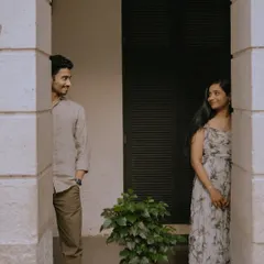A playful game of peek-a-boo between the pillars of a heritage building. This creative shot adds a fun and unique element to their Mumbai pre-wedding story.
