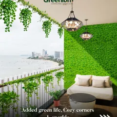 The finished look of a balcony paradise. With a full artificial grass wall, hanging plants, and cozy seating, this space is now the perfect spot to relax and enjoy the view, day or night.