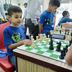 A young player carefully considers his next move. My chess program is designed to teach patience, foresight, and critical thinking from the very first lesson.