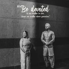 A timeless black and white portrait of the couple, their poses creating a sense of classic elegance and devotion.