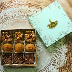 My fusion mithai box is where tradition meets modern taste. This one features my popular Biscoff Besan Laddus, Nutella Brownie Squares, and crunchy nut bars, all packed in a beautiful festive box.
