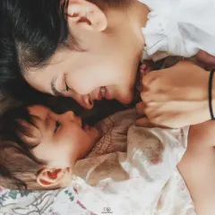 This is what a candid home session feels like. Just you and your baby, sharing a smile in the comfort of your own space, creating memories that are real and full of warmth.