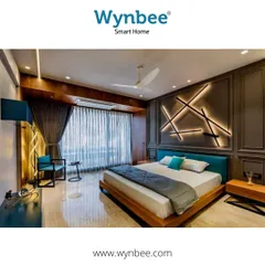 We make your room smarter with custom lighting designs. This bedroom features automated accent wall lighting that adds a layer of architectural beauty and modern convenience, all controlled through our smart home system.
