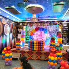 This is how I turn a banquet hall into a child's wonderland! A vibrant, large-scale Cocomelon theme for a first birthday party, complete with a multi-colored stage setup, character cutouts, and towering balloon columns.