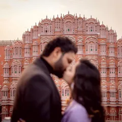 A stolen kiss with the iconic Hawa Mahal in Jaipur as the witness. This photo perfectly blurs the line between a grand, historic setting and an intimate, personal moment, which is the essence of a great destination shoot.