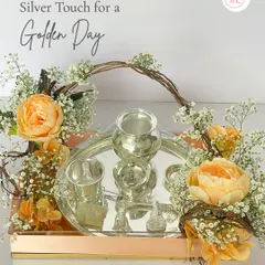 For a touch of timeless tradition, I create these stunning silver tray arrangements. This hamper features a set of pure silver-plated items, beautifully adorned with fresh, delicate flowers like peonies and baby's breath, making for a truly golden gift.