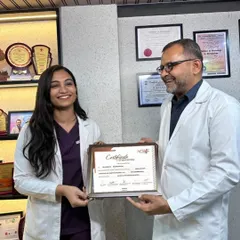 Receiving my certificate after a month of intensive dermatosurgery training. This experience has profoundly changed my outlook and equipped me with renewed knowledge to better serve my patients.