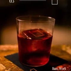 A classic dark cocktail from Bare, Worli. This photo captures a sophisticated and timeless vibe, appealing to users looking for a classic cocktail experience.