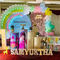 I love bringing colorful ideas to life, like this rainbow and princess combination for a first birthday. It features a pastel rainbow balloon arch, a sequin backdrop, a light-up marquee number, and custom-themed pedestals for the cake and desserts.