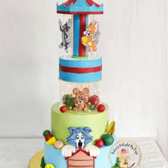 This was one of my most exciting projects: a rotating Tom and Jerry carousel cake. It combines playful, handcrafted characters with mechanical movement to create a truly interactive and memorable experience for a child's birthday party.