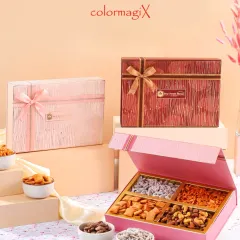 A showcase of our premium dry fruit boxes in elegant pink and red designs. These hampers are a healthy and sophisticated gift choice for festivals, weddings, and corporate events.