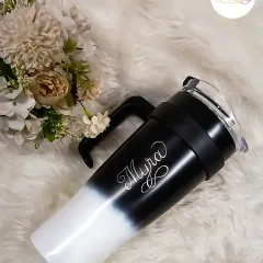 This custom engraved tumbler is one of my most popular requests. The elegant script of the name 'Myra' on this modern black and white sipper makes it a stylish and personal accessory for your daily hydration.