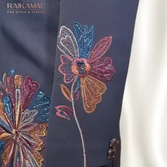 This image highlights the intricate, multi-colored floral embroidery on the sleeve of a Jodhpuri jacket. It’s a perfect example of how I blend desi roots with global trends.
