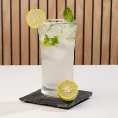 This mojito is shot in a bright, high-key style. This clean and refreshing look is perfect for a daytime cafe menu or a summer promotion.