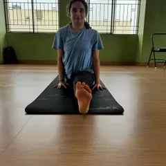 A front-facing view of the front split, showing the alignment of the hips and the engagement of the front leg. This is the result of dedicated practice.