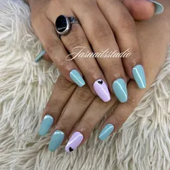 A sweet and simple pastel manicure. The mix of light blue and lilac with a tiny black heart accent is so cute and perfect for summer.