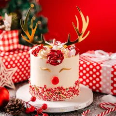 A festive and adorable reindeer cake for your Christmas celebration. This design features buttercream frosting, a cute red nose, and golden antlers, making it a hit with both kids and adults.