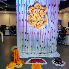 For Diwali and Ganesh Chaturthi celebrations in offices or homes, I create traditional backdrops using marigold flowers. Here, I designed a Ganesha motif entirely out of fresh flowers against a curtain of floral strings.