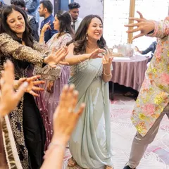 Leading the guests on the dance floor during a wedding reception. It is all about creating a fun, inclusive atmosphere where everyone wants to dance.