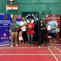 Another proud winner being recognized for his performance. Our in-house tournaments are a highlight for our adult players, offering a platform to test their skills and connect with fellow badminton enthusiasts.
