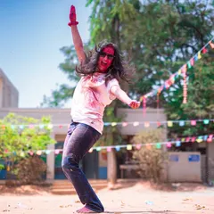 Pure joy and freedom during a Holi event. This is me, covered in colors, just letting go and dancing.