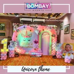 For a truly magical first birthday, I designed this dreamy unicorn theme. The setup includes a custom backdrop with the birthday girl's name, pastel pink balloon arrangements, and a light-up number '1' surrounded by unicorn cutouts.