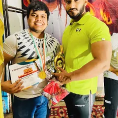 With my 'bade bhai' and student after his win. I stand by my team through every prep and every competition.