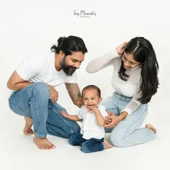 A candid moment of family interaction. The minimalist white background keeps the focus on the love and connection you share.
