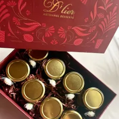 A perfect gift box for any occasion, this hamper is filled with eight of our signature dessert jars, each with a golden lid.